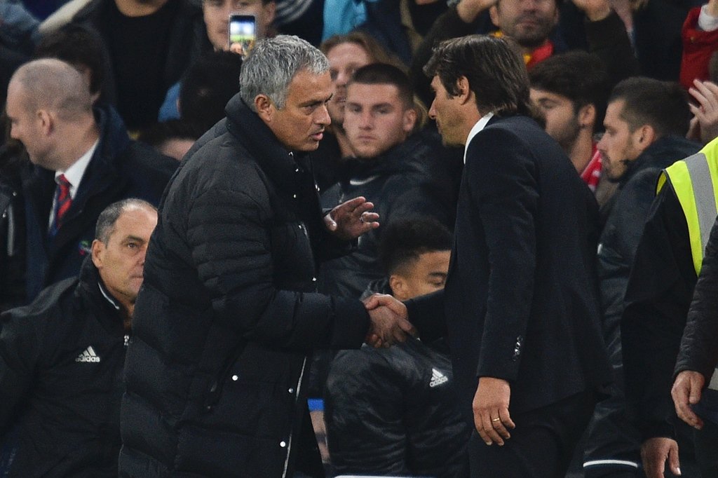 jose mourinho l shakes hands with antonio conte r after the final whistle on october 23 2016 photo afp