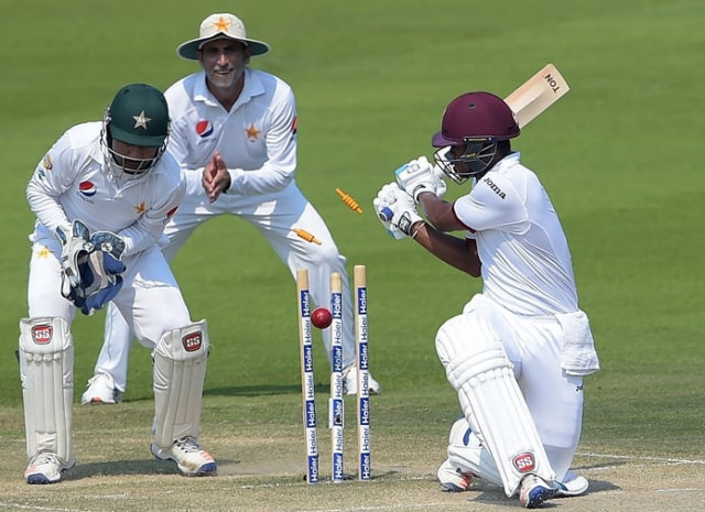 leon johnson r is bowled by yasir shah in abu dhabi photo afp leon johnson r is bowled by yasir shah in abu dhabi photo afp