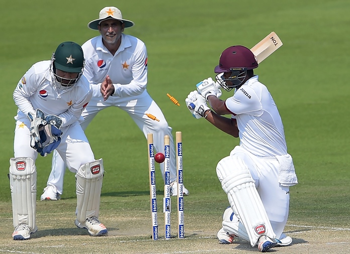 leon johnson r is bowled by yasir shah in abu dhabi photo afp