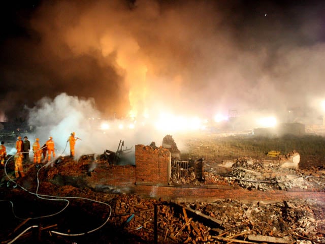 a file photo of chinese firefighters extinguishing a fire after an explosion at a fireworks factory in yichun photo afp file