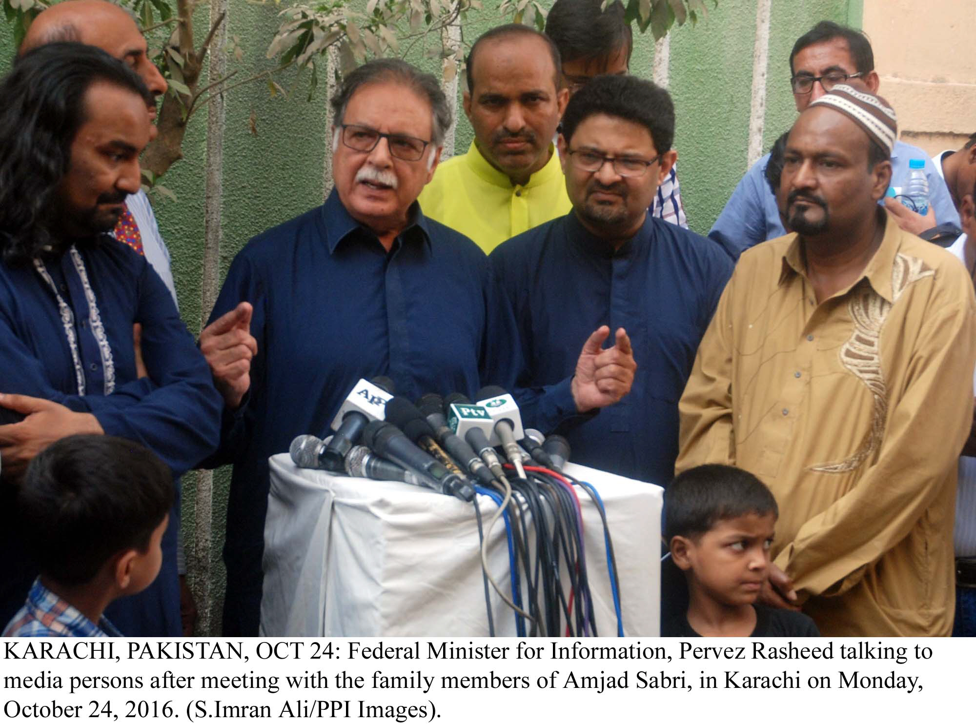 pervez rasheed talking to media person after meeting with family members of amjab sabri photo ppi