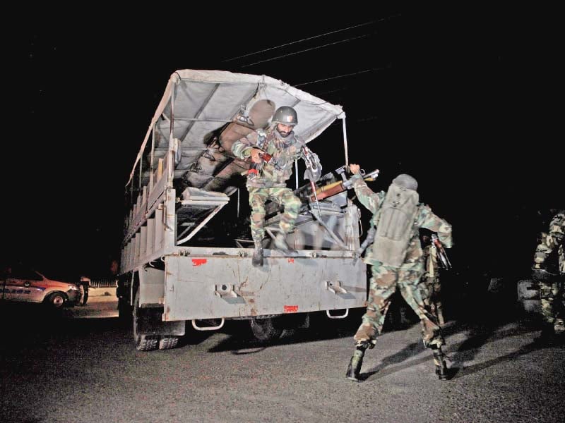 troops deploy outside the police training centre after gunmen opened fire on the facility photo reuters