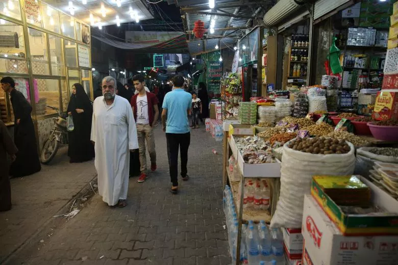 people walk at a market in kerbala southwest of baghdad iraq september 26 2016 photo reuters people walk at a market in kerbala southwest of baghdad iraq september 26 2016 photo reuters