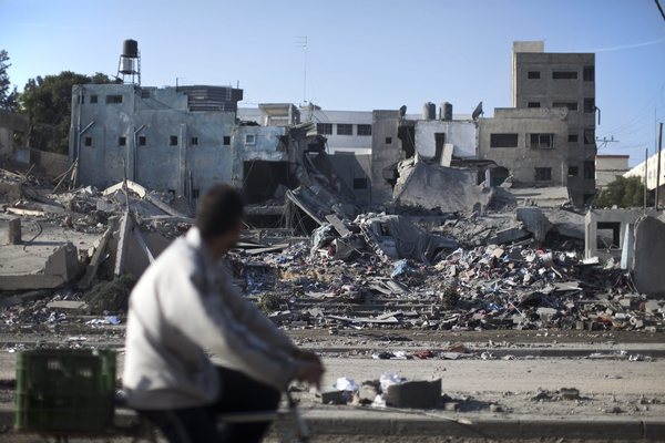 palestinian man looks at the ruins of a hamas police station destroyed by an israeli airstrike in gaza city 20 november 2012 photo epa