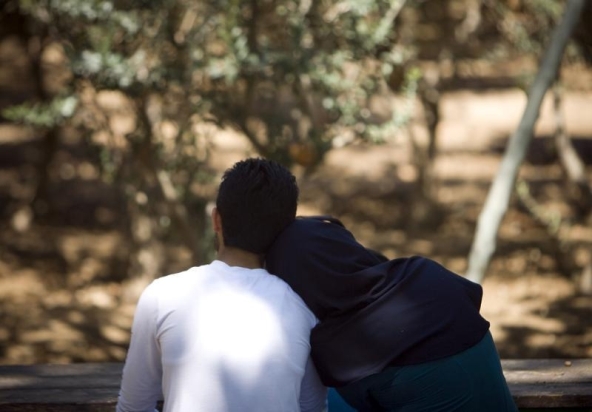 an iranian couple rest at a park in central tehran april 10 2009 photo reuters