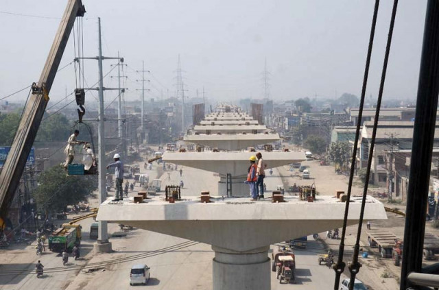 engineers busy in civil work at the lahore metro s orange line photo file engineers busy in civil work at the lahore metro s orange line photo file