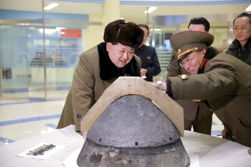north korean leader kim jong un looks at a rocket warhead tip after a simulated test of atmospheric re entry of a ballistic missile at an unidentified location in this undated file photo released by north korea 039 s korean central news agency kcna in pyongyang on march 15 2016 photo reuters
