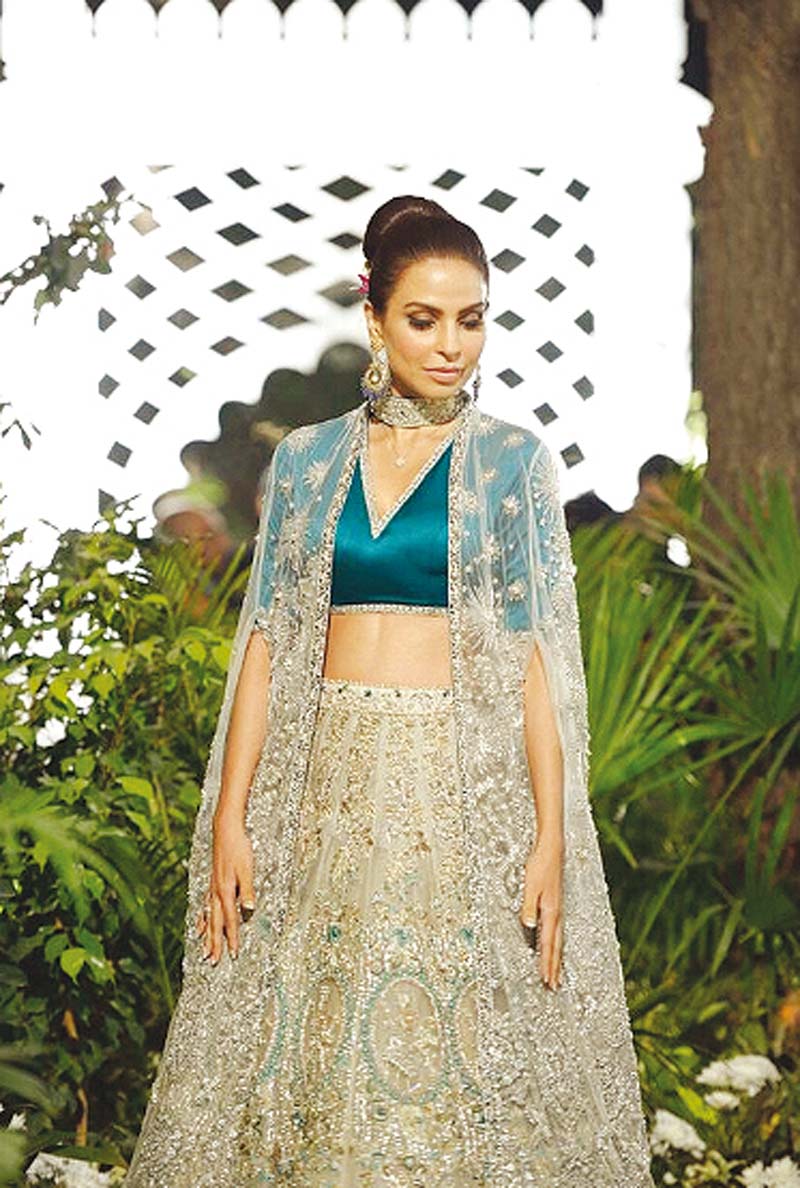 a standout ensemble worn by fauzia aman was a ferozi choli and a lengha with lan s signature silver filigree all over photo file