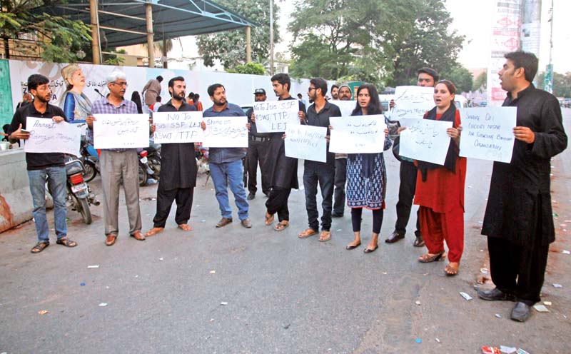 a group from the civil progressive alliance stages a protest against the attack on a quetta police training centre outside the karachi press club on wednesday photo athar khan express