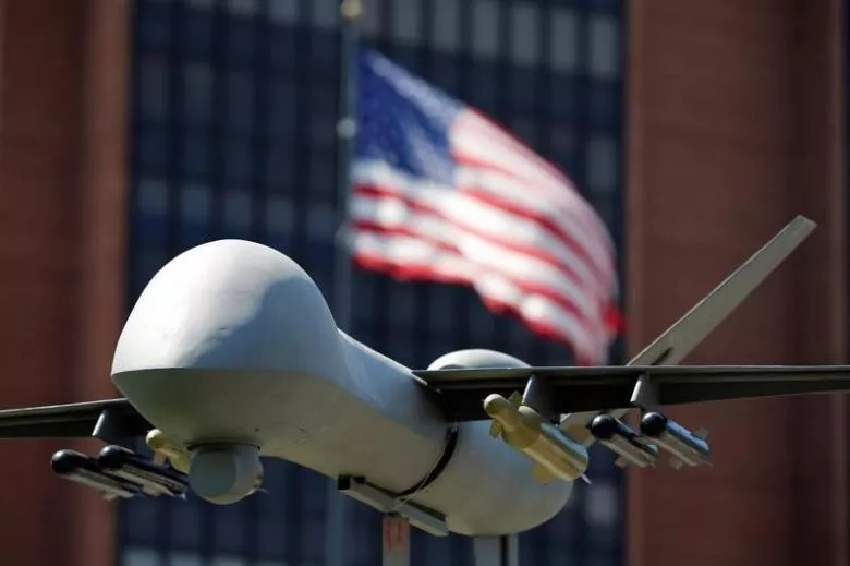 a model of a military drone is seen in front of an us flag as protesters rally against climate change ahead of the democratic national convention in philadelphia pennsylvania us july 24 2016 photo reuters a model of a military drone is seen in front of an us flag as protesters rally against climate change ahead of the democratic national convention in philadelphia pennsylvania us july 24 2016 photo reuters
