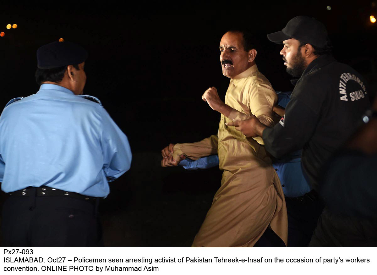 policemen seen arresting activist of pti won the occasion of party 039 s worker convention photo online