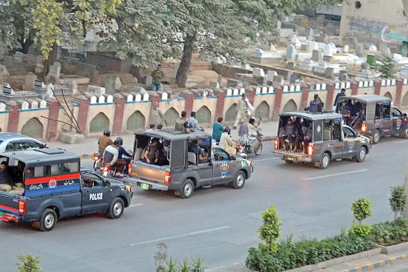 police conduct a flag march in rawalpindi ahead of pti s planned protest photo express police conduct a flag march in rawalpindi ahead of pti s planned protest photo express