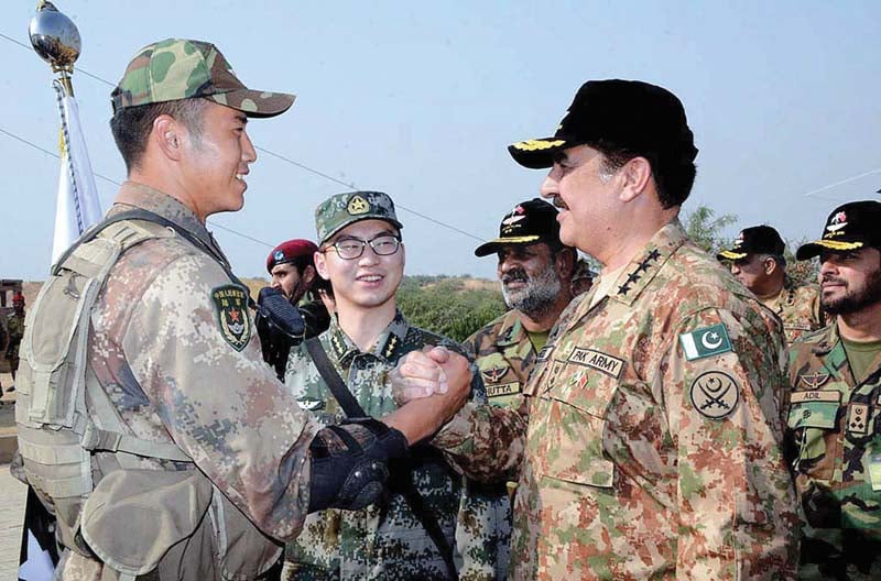 army chief meets a chinese soldier on his visit to the national counter terrorism training centre in pabbi photo app