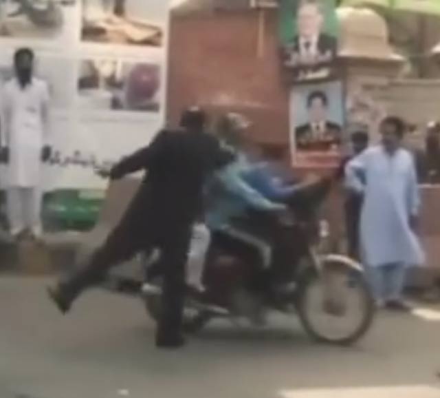 advocate shahid naseem gondal slaps children on a motorcycle on lahore 039 s mall road