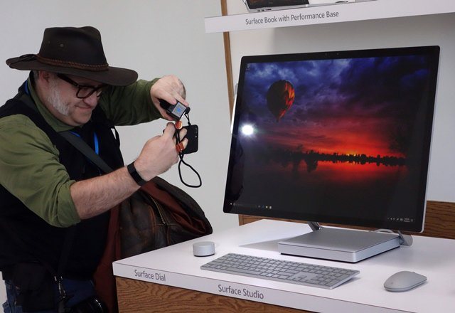a man gets a look at the new microsoft surface studio introduced at a microsoft news conference photo afp