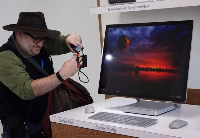 a man gets a look at the new microsoft surface studio introduced at a microsoft news conference photo afp a man gets a look at the new microsoft surface studio introduced at a microsoft news conference photo afp