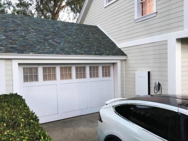 tesla 039 s electric car powerwall and solar roof are shown by tesla motors inc chief executive elon musk unveiling new energy products aimed at illustrating the benefits of combining his electric car and battery maker with solar installer solarcity corp in los angeles california u s october 28 2016 photo reuters