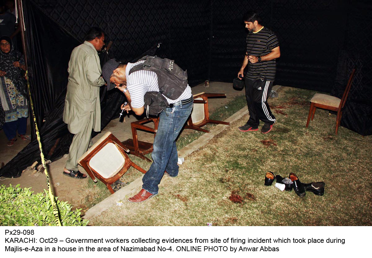 security officials collect evidences from the site of firing in nazimabad no 4 on october 29 2016 photo online