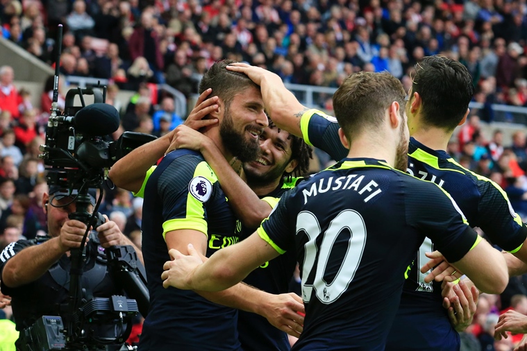 arsenal 039 s french striker olivier giroud l is congratulated after scoring their third goal during the english premier league football match between sunderland and arsenal at the stadium of light in sunderland northeast england on october 29 2016 photo afp