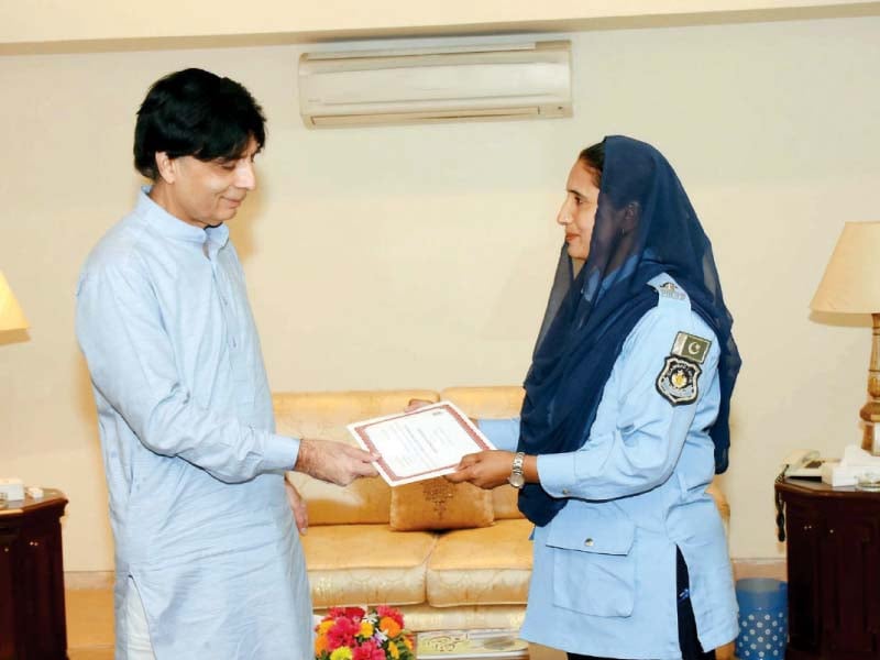 interior minister chaudhry nisar presents a commendation certificate to asi farzana begum photo app