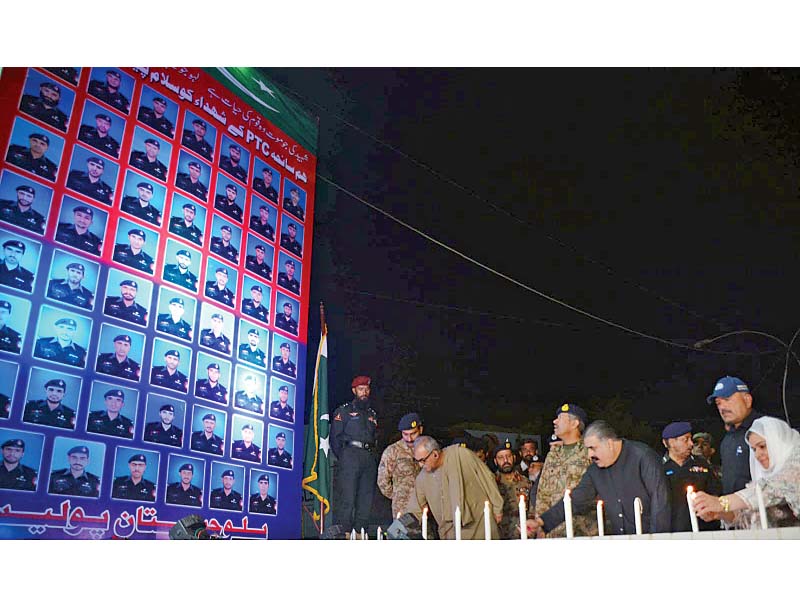 cm zehri lights a candle during a vigil in memory of the martyrs of the police training centre in quetta photo inp