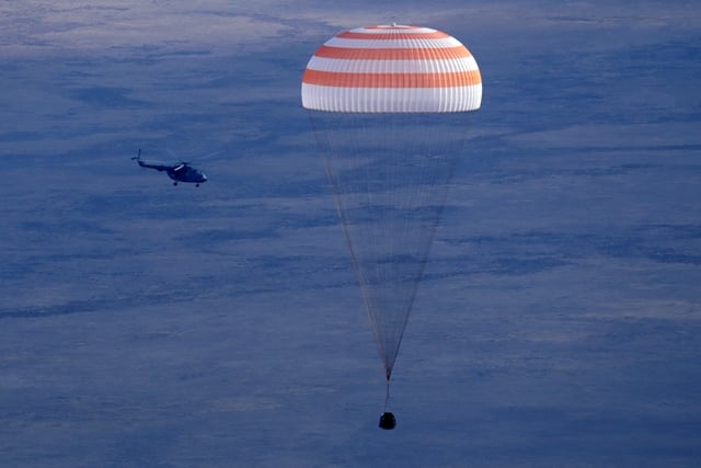 russia s soyuz ms space capsule carrying the international space station iss crew of us astronaut kate rubins russian cosmonaut anatoly ivanishin and japanese astronaut takuya onishi lands in a remote area some 150 km south east of dzhezkazgan in kazakhstan on october 30 2016 photo afp