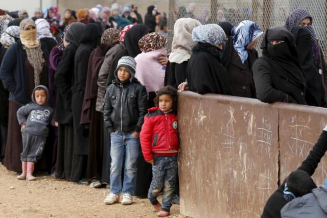 image showing refugees outside a refugee camp photo reuters