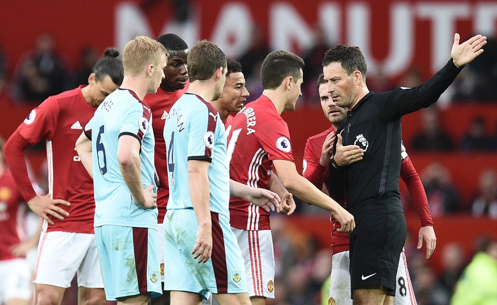 mark clattenburg r gestures to ander herrera to leave the field photo afp