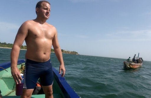 british swimmer ben hooper stands on a boat during a cross atlantic training session as he prepares to swim from africa to brazil photo afp