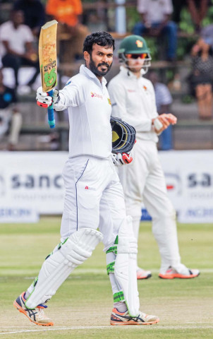 tharanga raises his bat in celebration as he became the second sri lankan batsman to score a century in the first innings photo afp tharanga raises his bat in celebration as he became the second sri lankan batsman to score a century in the first innings photo afp