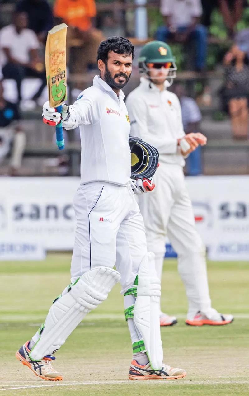tharanga raises his bat in celebration as he became the second sri lankan batsman to score a century in the first innings photo afp tharanga raises his bat in celebration as he became the second sri lankan batsman to score a century in the first innings photo afp