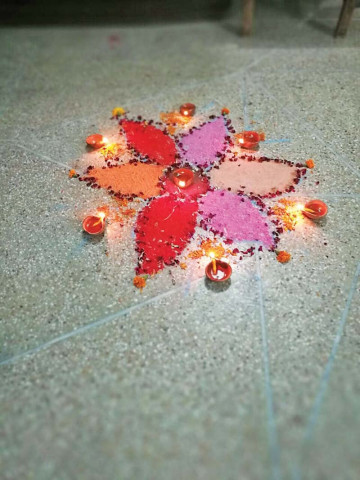 a rangoli with lit oil lamps at a house in rawalpindi to celebrate diwali photo express a rangoli with lit oil lamps at a house in rawalpindi to celebrate diwali photo express