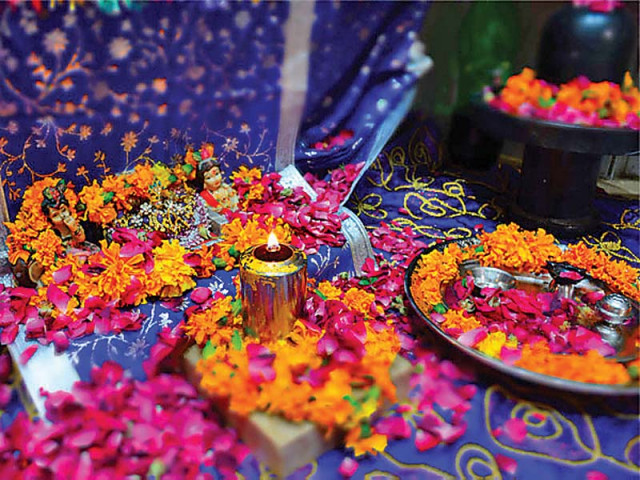 a lamp is lit among other offerings at a local temple for diwali photo express a lamp is lit among other offerings at a local temple for diwali photo express