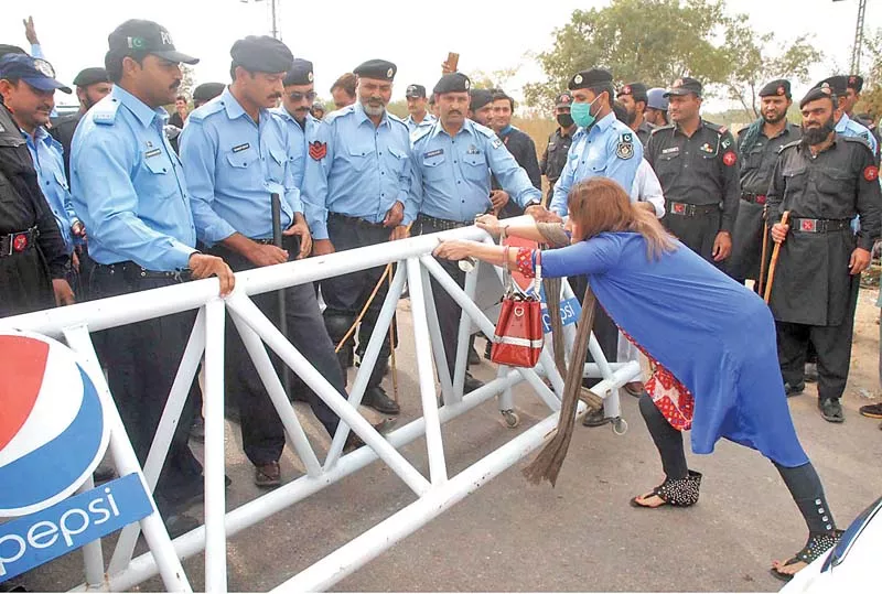pti activist pushes a barrier on the blocked road leading to imran khan s residence in bani gala photo online pti activist pushes a barrier on the blocked road leading to imran khan s residence in bani gala photo online