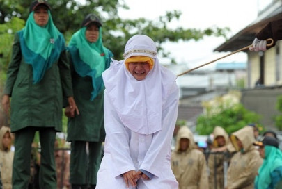 indonesian woman caned for standing too close to boyfriend indonesian woman caned for standing too close to boyfriend
