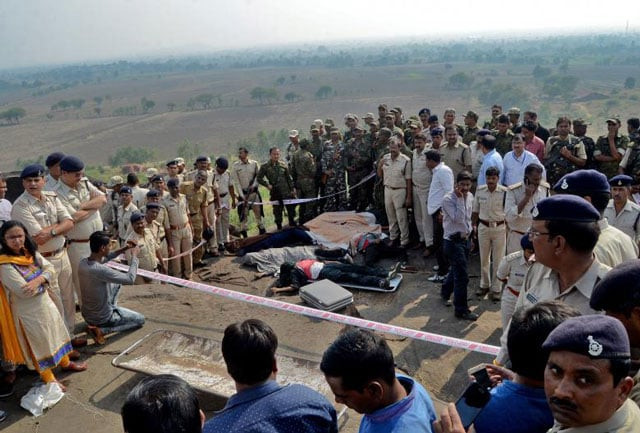 police officers and special task force soldiers stand beside dead bodies of the suspected members of the banned students islamic movement of india simi who earlier today escaped the high security jail in bhopal and later got killed in an encounter at the acharpura outside bhopal photo reuters police officers and special task force soldiers stand beside dead bodies of the suspected members of the banned students islamic movement of india simi who earlier today escaped the high security jail in bhopal and later got killed in an encounter at the acharpura outside bhopal photo reuters
