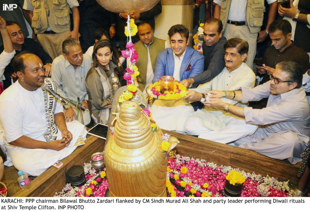 ppp chairman bilawal bhutto zardari flanked by cm murad ali shah and party leader performing dewali rituals at shiv temple clifton photo inp ppp chairman bilawal bhutto zardari flanked by cm murad ali shah and party leader performing dewali rituals at shiv temple clifton photo inp