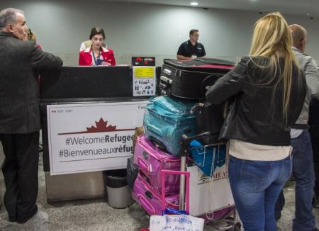 syrian refugees check their baggage at the beginning of an airlift to canada at the beirut international airport photo reuters