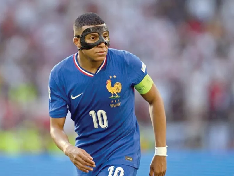 kylian mbappe wearing a mask over his broken nose returned to action and scored in france s draw with poland at euro 2024 on tuesday photo afp kylian mbappe wearing a mask over his broken nose returned to action and scored in france s draw with poland at euro 2024 on tuesday photo afp
