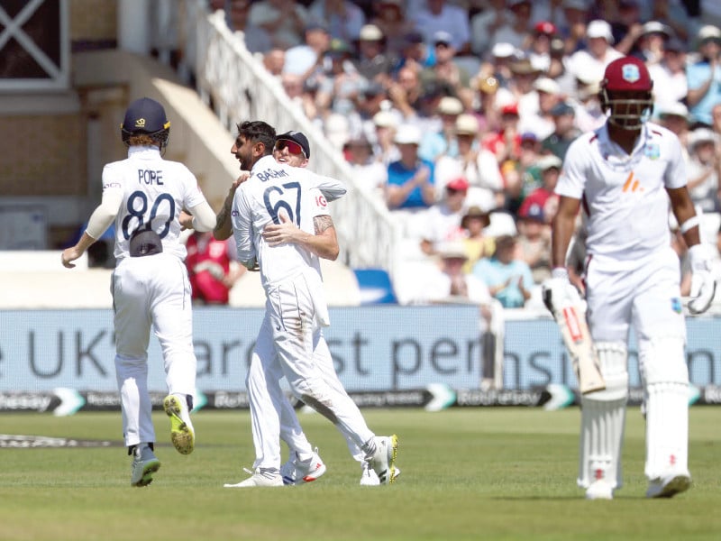 england s shoaib bashir 2l celebrates after taking the wicket of west indian mikyle louis on the second day of the second test at trent bridge on friday photo afp