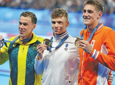 leon marchand bags two olympic golds