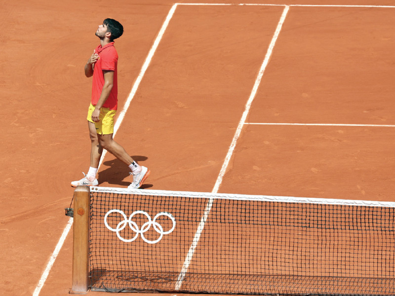 carlos alcaraz of spain reacts after winning the semifinal against felix auger aliassime of canada on friday photo reuters