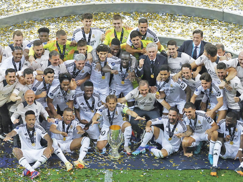 real madrid players are celebrating their victory over atlanta in the uefa super cup final photo afp