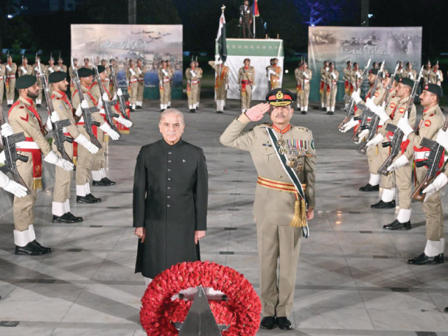 prime minister shehbaz sharif and army chief gen asim munir pay respects at the martyrs monument during a defence day ceremony at the general headquarters in rawalpindi photo express prime minister shehbaz sharif and army chief gen asim munir pay respects at the martyrs monument during a defence day ceremony at the general headquarters in rawalpindi photo express
