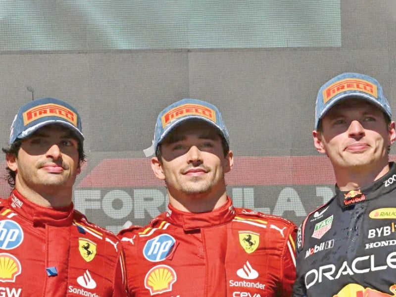 ferrari s drivers charles leclerc centre and carlos sainz jr finished one and two respectively while red bull racing s max verstappen right finished third at the united states formula one grand prix at the circuit of the americas in austin photo afp