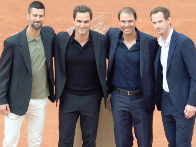 rafael nadal second right was joined by novak djokovic left roger federer and andy murray right to celebrate nadal s 14 men s singles titles at the french open photo afp