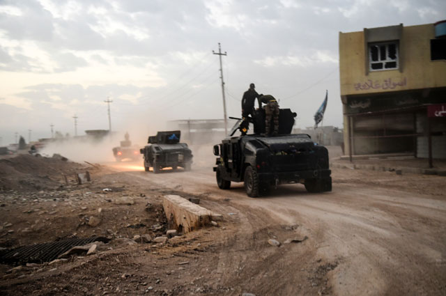 members of the iraqi counter terrorism service cts drive near the village of bazwaya on the eastern edges of mosul tightening the noose on mosul as the offensive to retake the islamic state group stronghold entered its third week on october 31 2016 photo afp