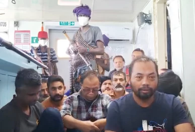a screengrab of a video shows crew members of an indonesia flagged vessel held hostage by somali pirates