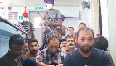 a screengrab of a video shows crew members of an indonesia flagged vessel held hostage by somali pirates