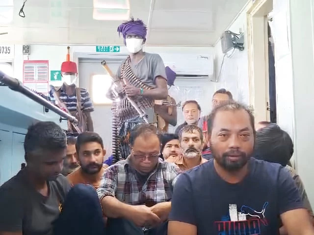 a screengrab of a video shows crew members of an indonesia flagged vessel held hostage by somali pirates